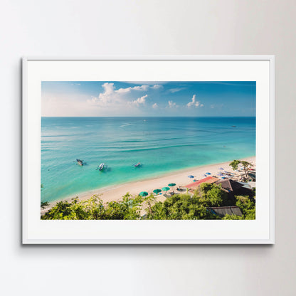 Tropical blue ocean, sandy beach and boats in Indonesia, Bali