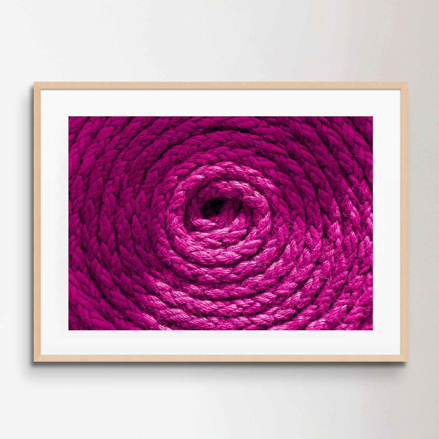 Heavy-duty magenta pink coiled ships rope