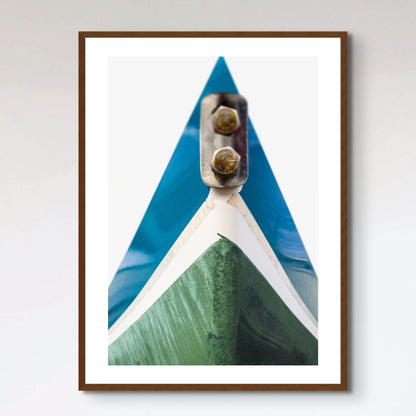 Blue and green hull of sail boat